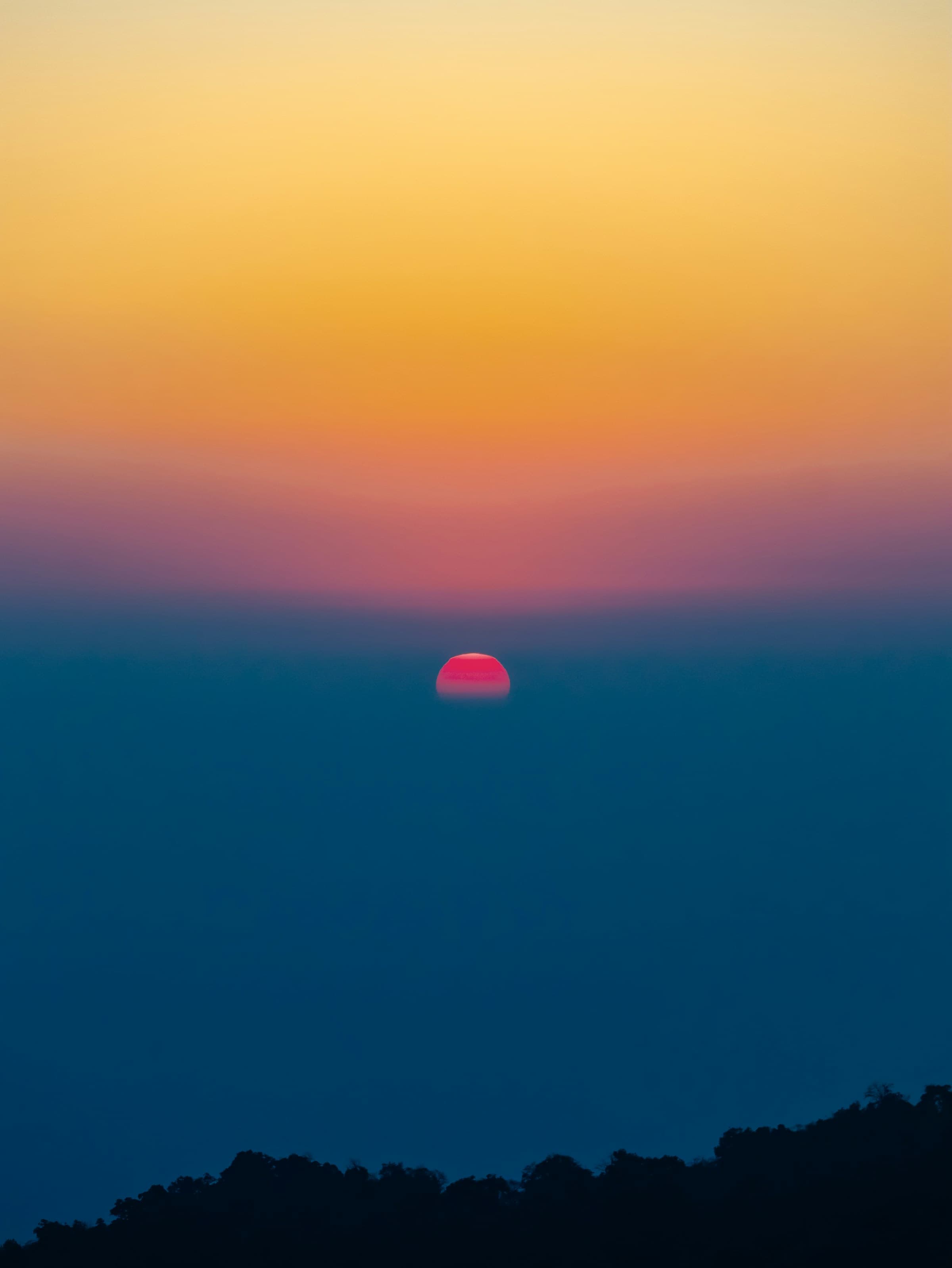 Stunning sunset over mountains - TinyStoked adventure books background